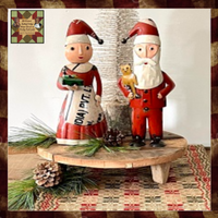 Mrs Clause Holding a Present Metal Art