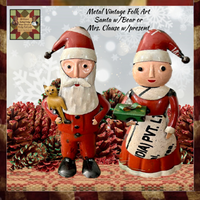 Mrs Clause Holding a Present Metal Art