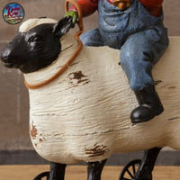 Santa Riding Sheep Folk Art